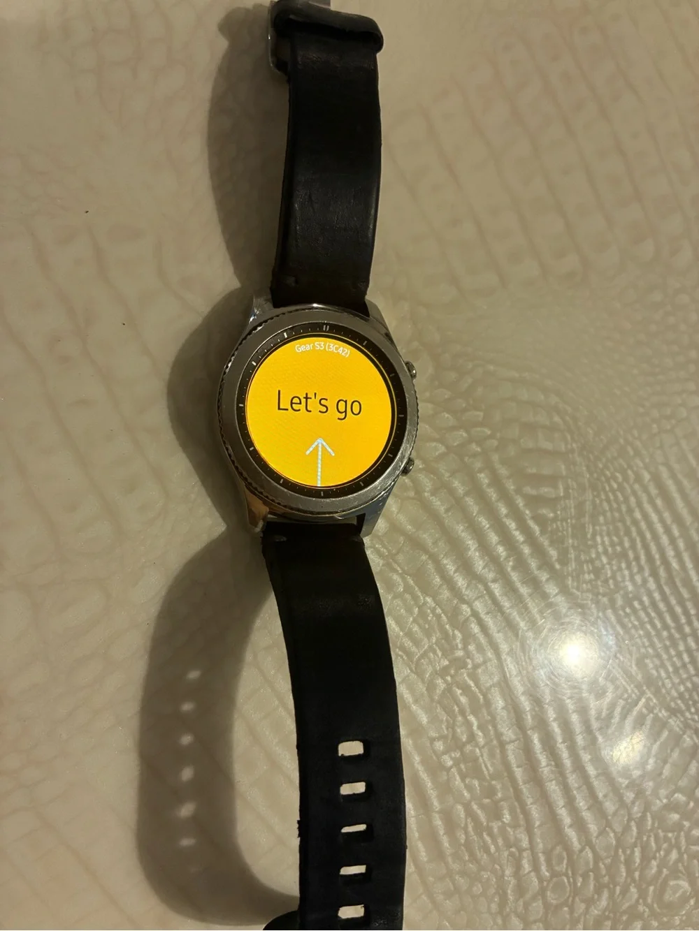 Samsung Silver Smartwatch with Black Strap and Blue Display